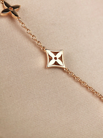 [CA]STAR AND SUN 7 MOTIFS GOLD BRACELET