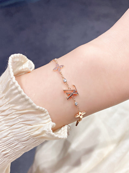 [CA]STAR AND SUN 7 MOTIFS GOLD BRACELET