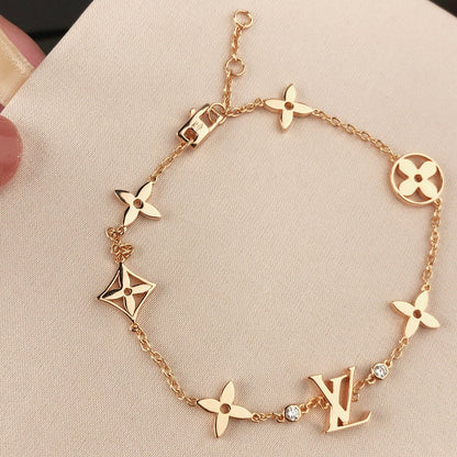 [CA]STAR AND SUN 7 MOTIFS GOLD BRACELET